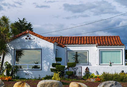 Spanish style sing family home with red tile roof