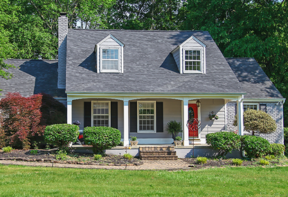 2 story light blue single family home