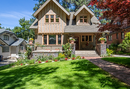 2 story single family home with stone porch