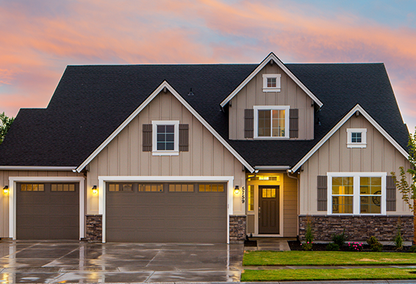 Tan and white home with brown shutters