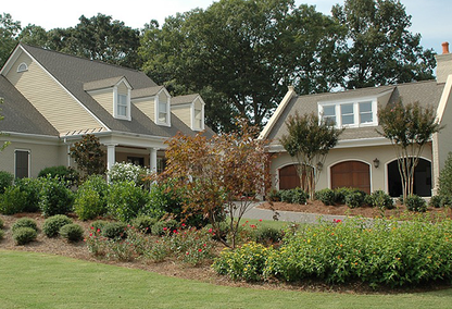 Single family home with separate garage and ADU on top