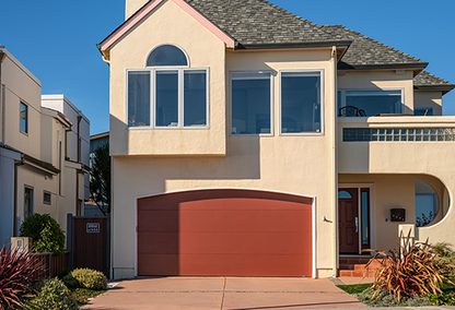 2 story single family home with red garage door