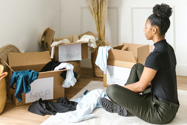 Picture of a woman decluttering her home.