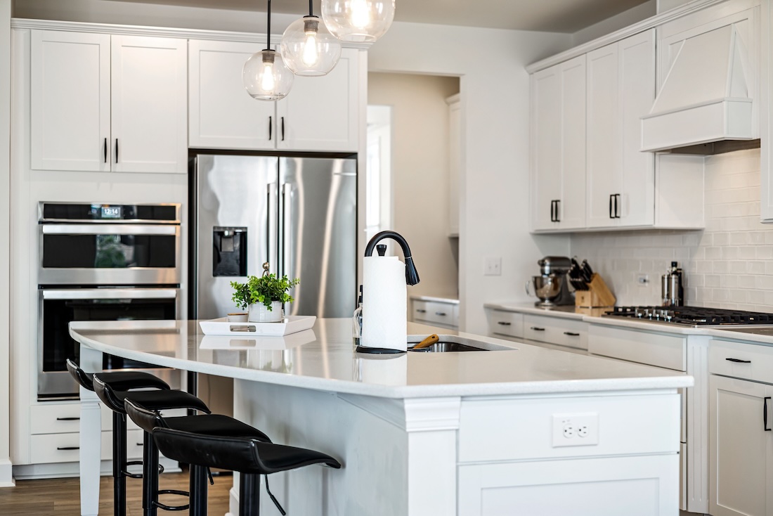 white kitchen with stools