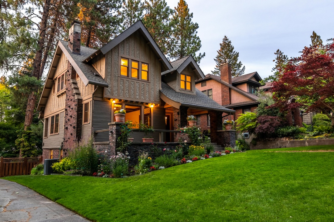 Home with front porch and green lawn