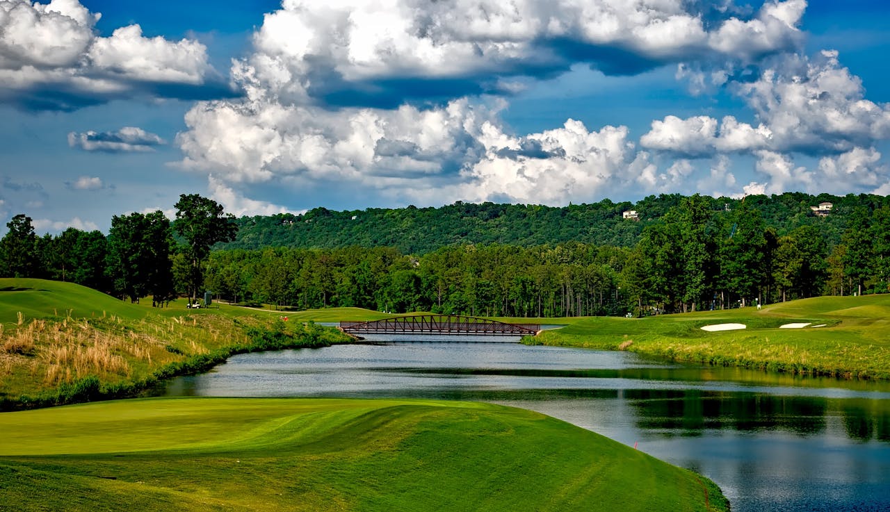 Golf course fairways with bridge over creek